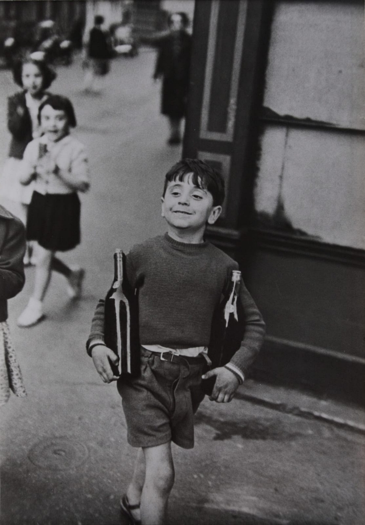 Henri Cartier-Bresson, Boy Carrying a Wine Bottle (Rue Mouffetard, Paris, 1954)